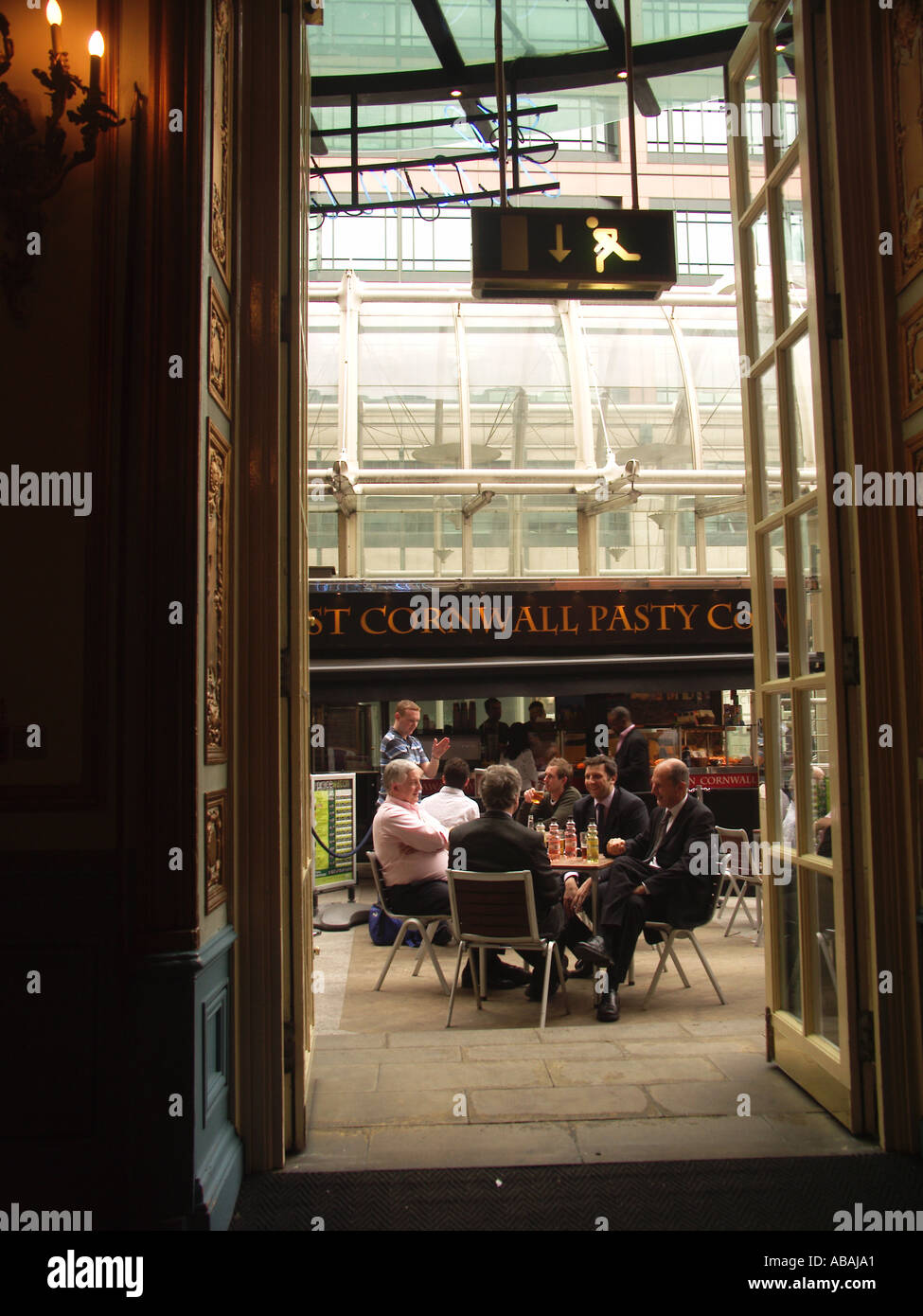 Men in suits drinking outside table London Stock Photo