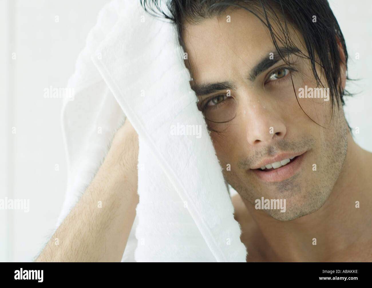 Man drying hair with towel Stock Photo Alamy