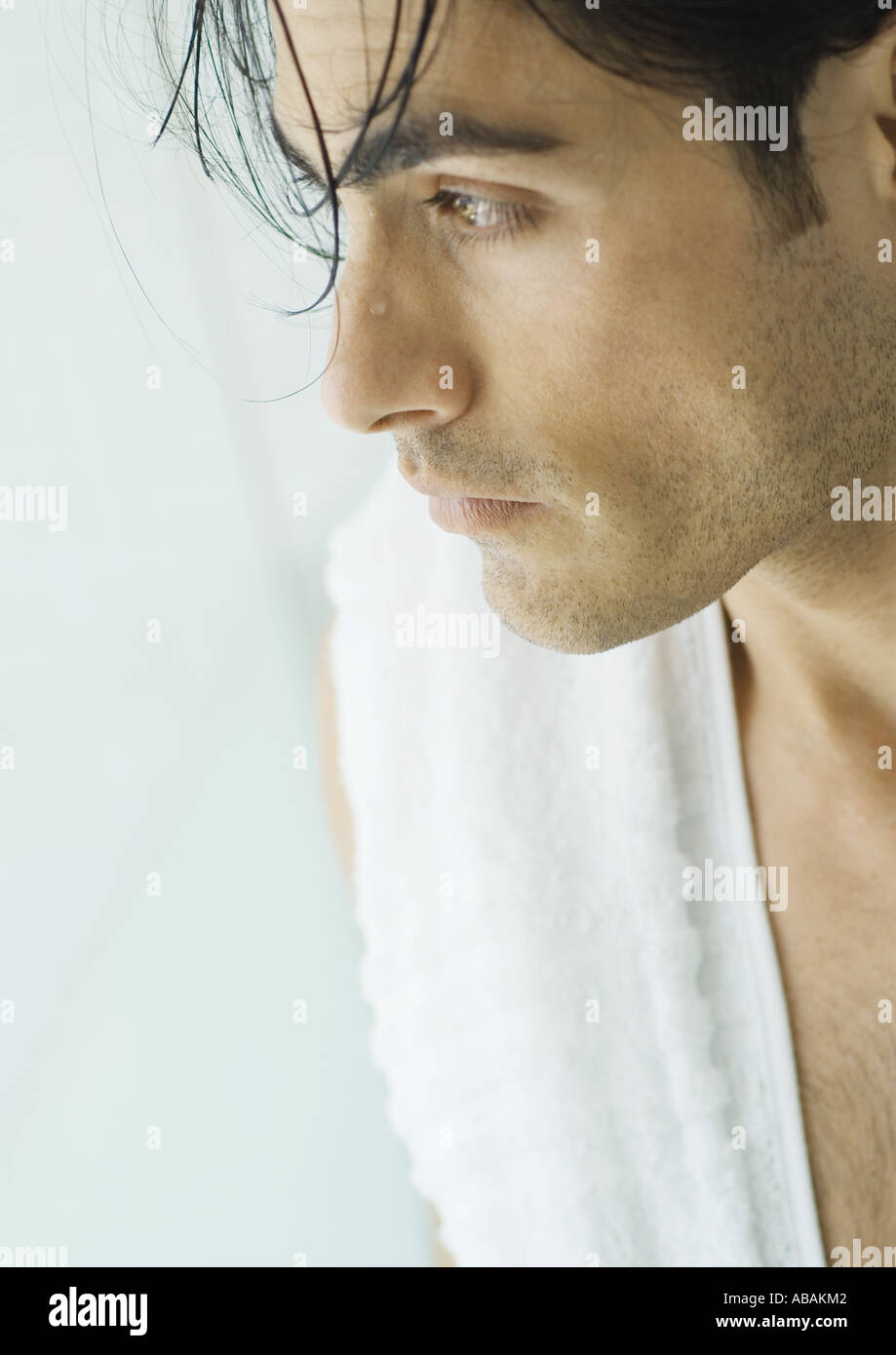 Man with wet hair and towel over shoulder Stock Photo