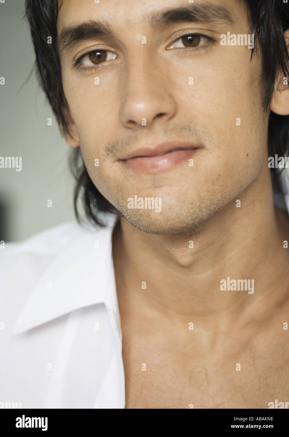 Man wearing unbuttoned white shirt hires stock photography and images