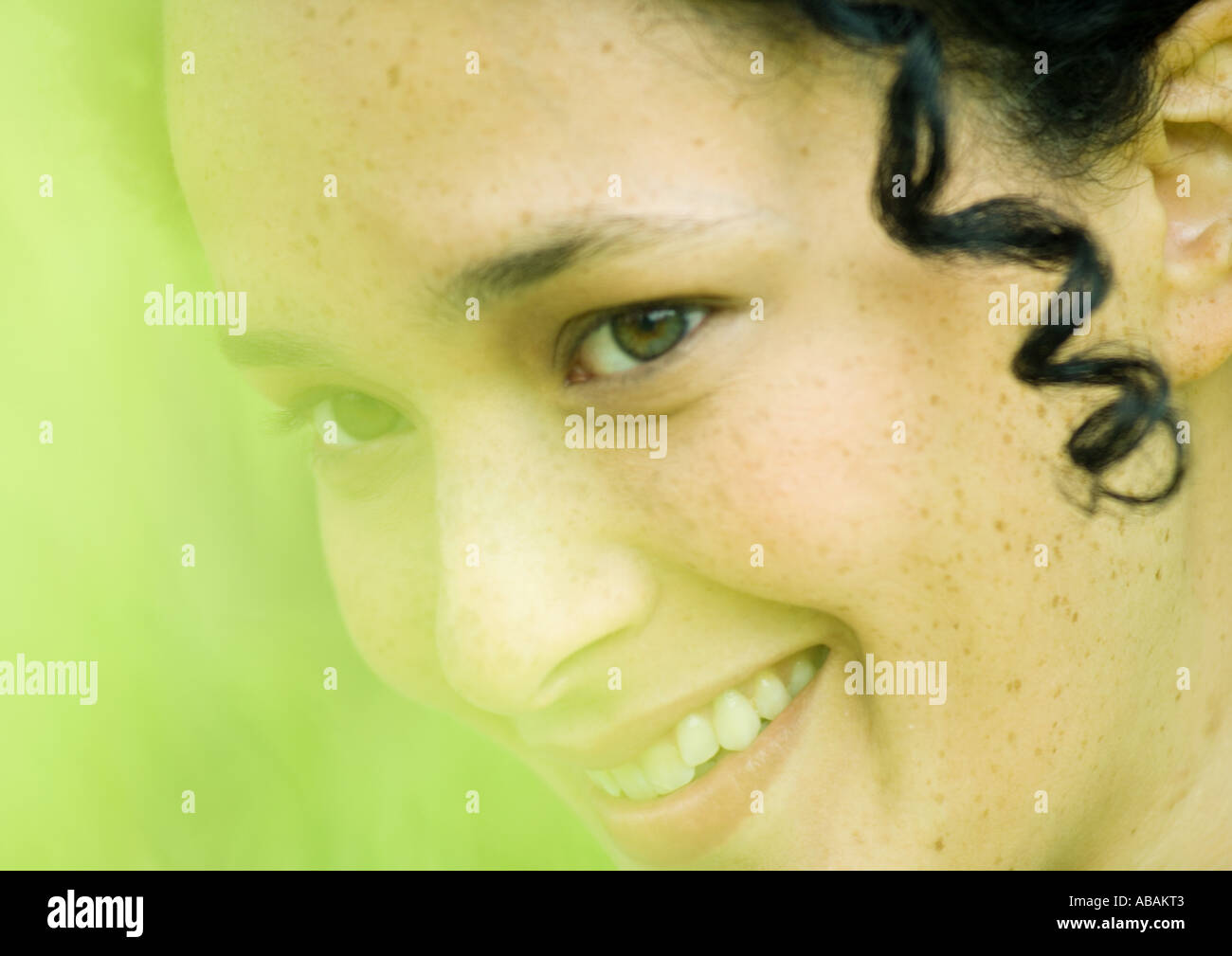 Smiling person in green hi-res stock photography and images - Alamy