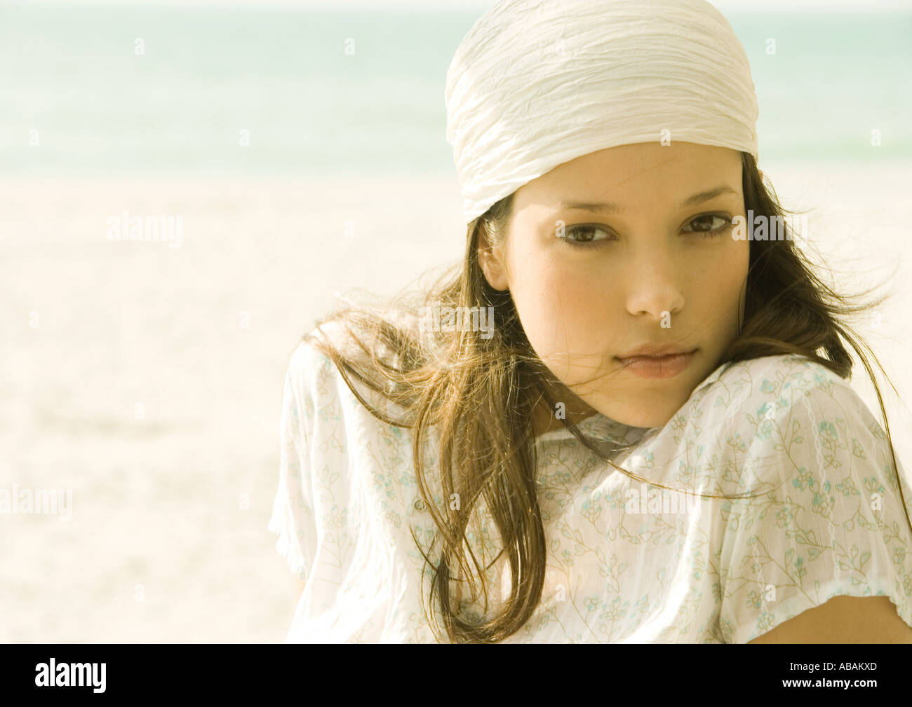 Woman wearing headscarf on beach, portrait Stock Photo Alamy