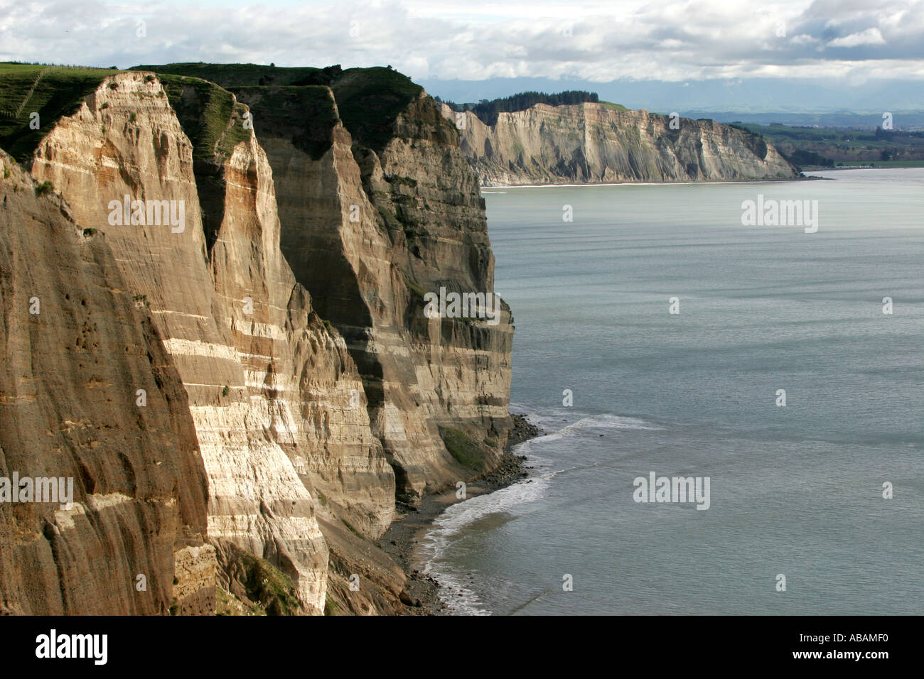 Cliffs show clear geological strata and volcanic layers near Cape Kidnappers in New Zealand s Hawke's Bay Stock Photo