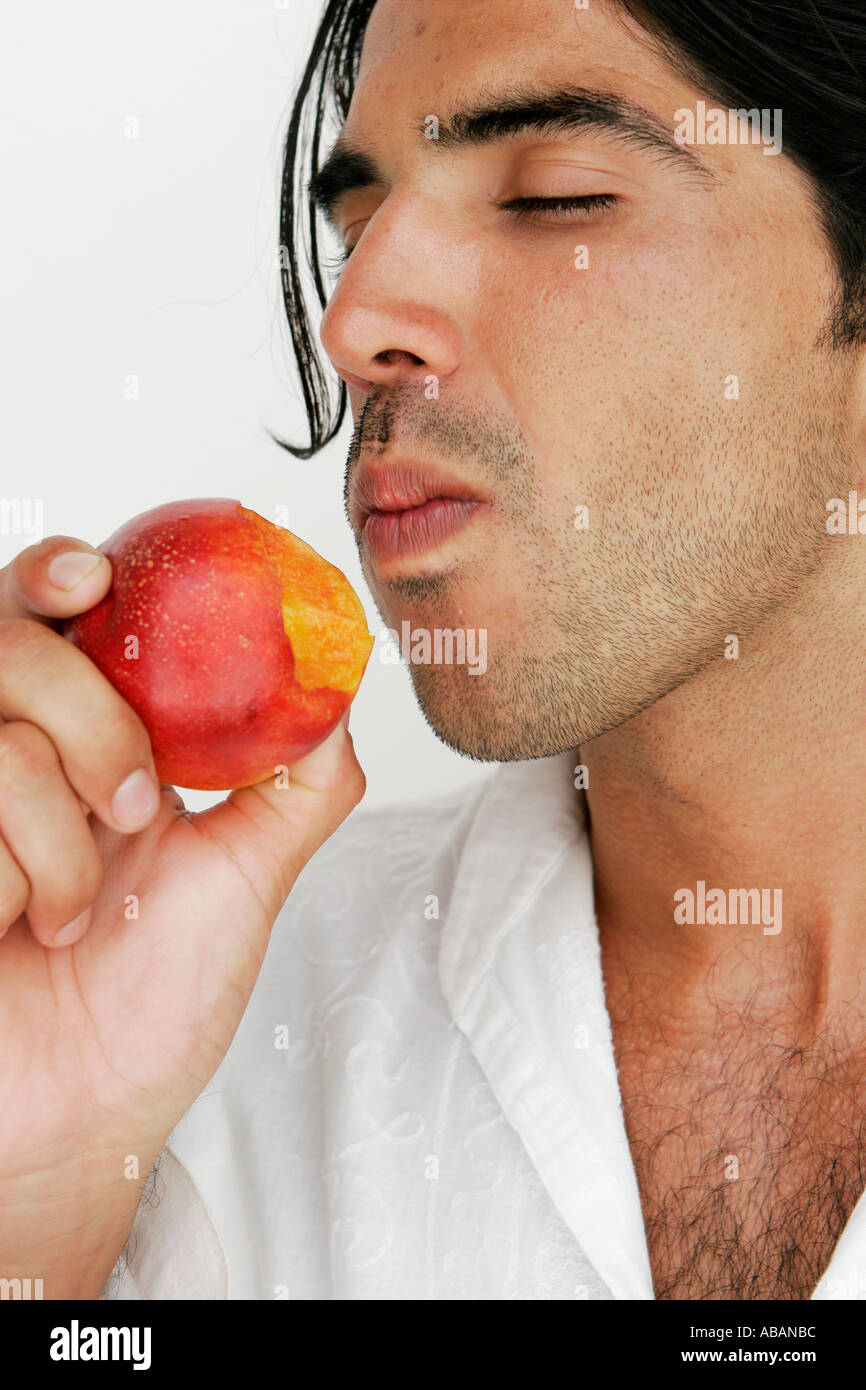 Man eating peach hires stock photography and images Alamy