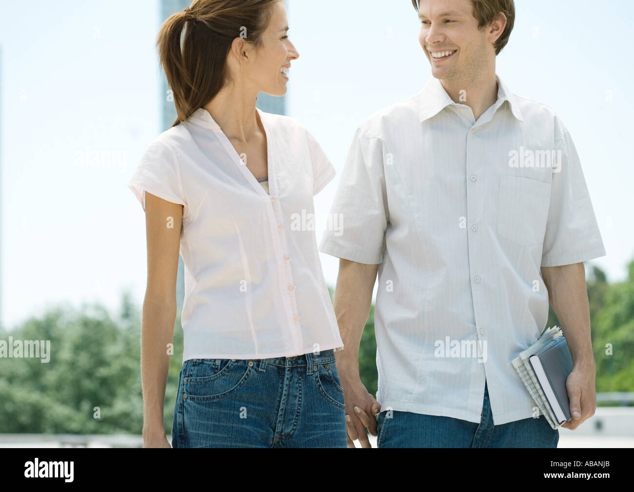 College students walking holding hands hi-res stock photography and ...