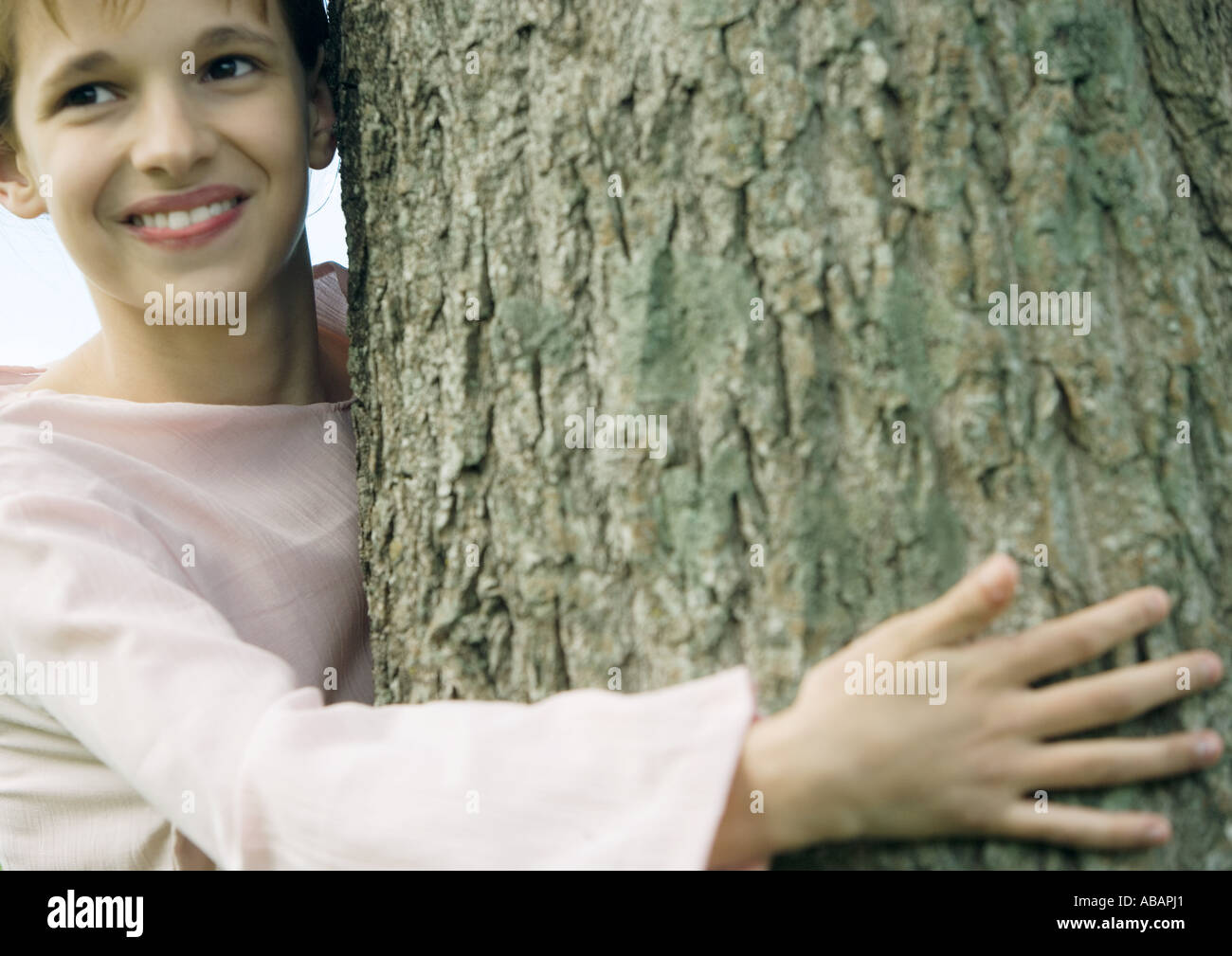 Girl touches bark tree tree hi-res stock photography and images - Alamy