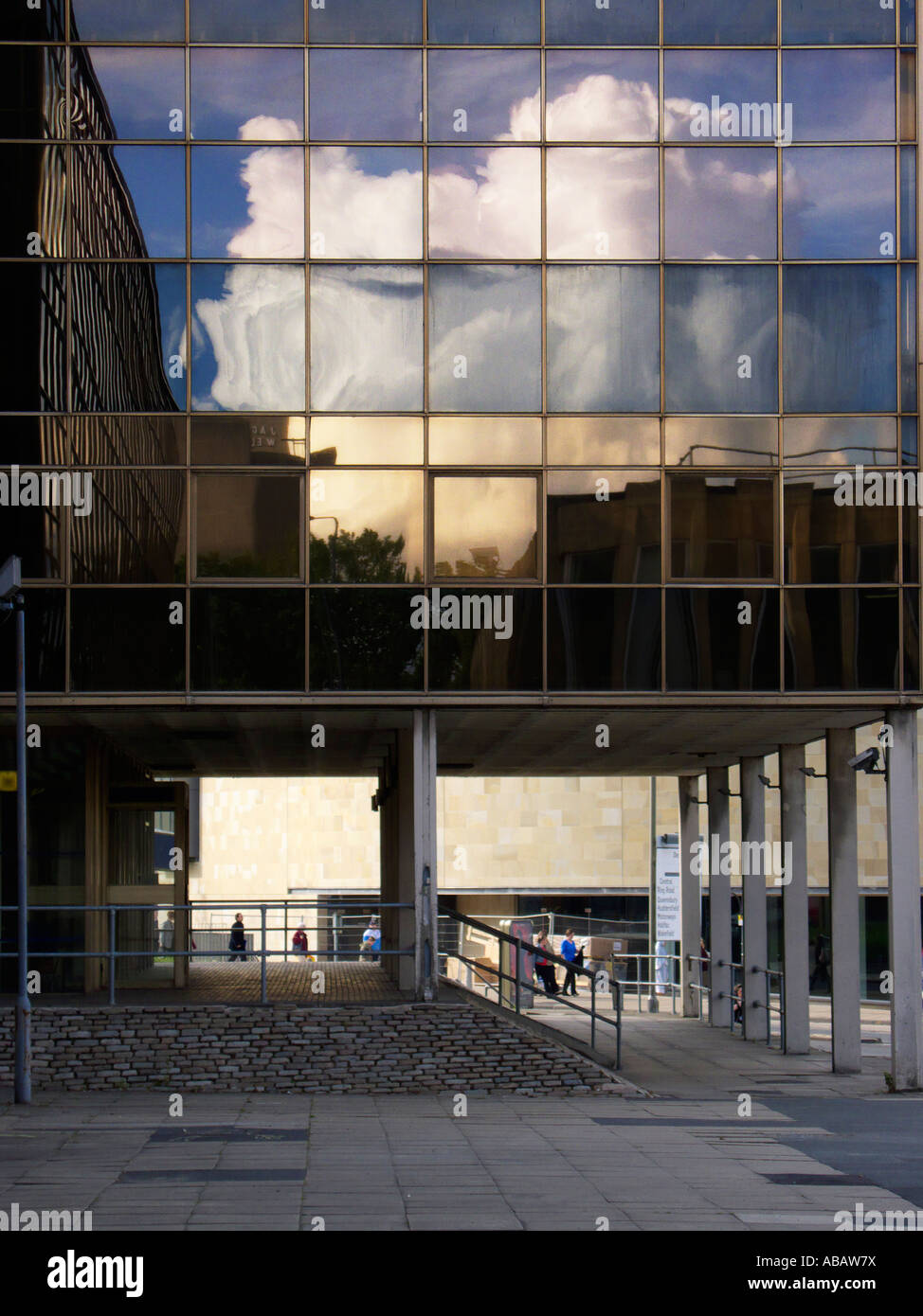 Blue sky and cloud reflected in a modern steel and glass building Stock ...