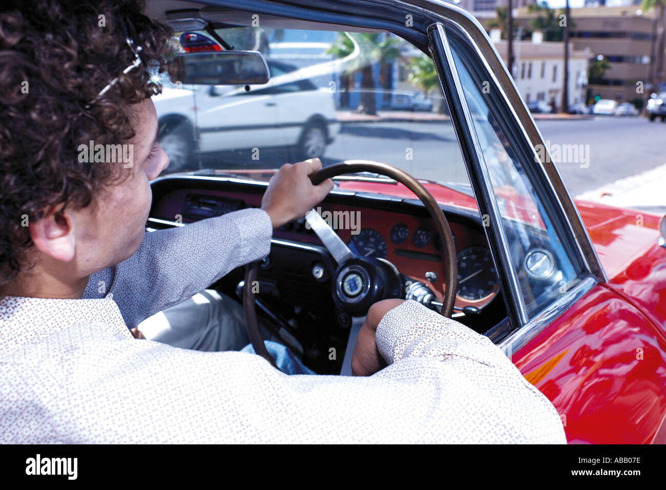 Man in driving a convertible Stock Photo