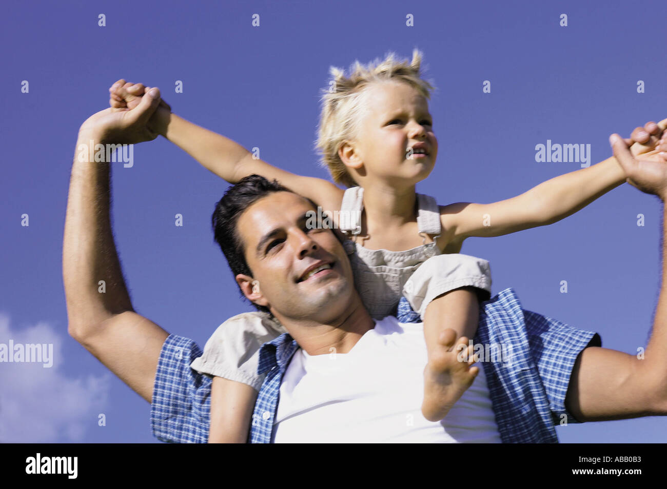 Father carrying son Stock Photo
