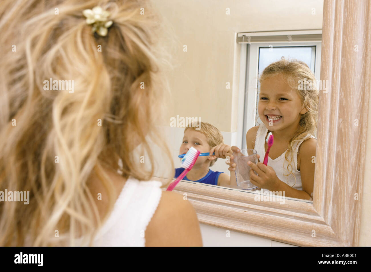 Kids brushing teeth Stock Photo