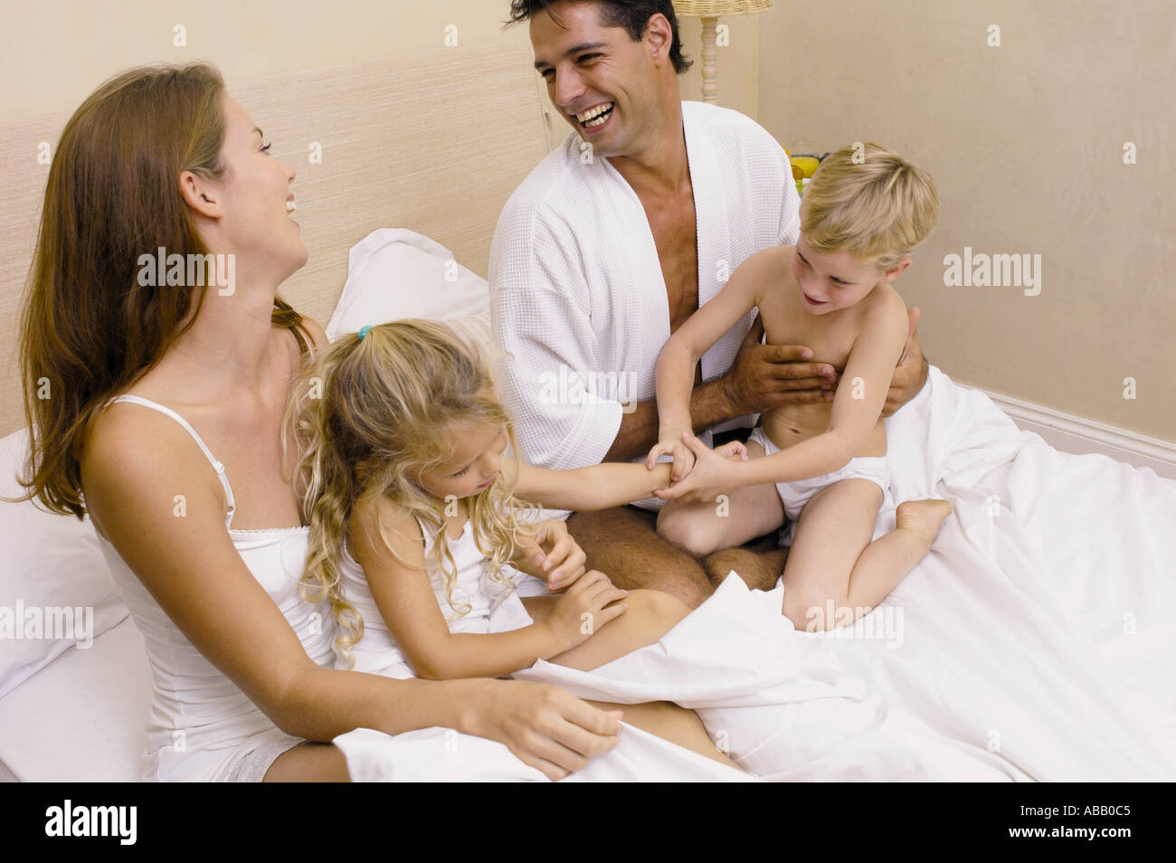 Family in bed Stock Photo