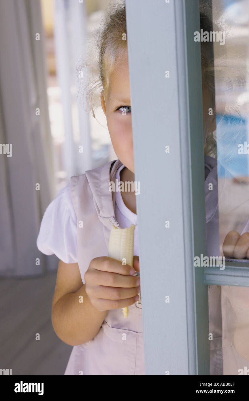 Girl Eating Banana Stock Photo Alamy