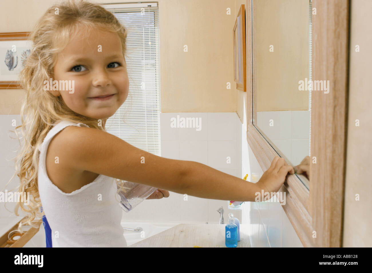Girl in bathroom Stock Photo - Alamy