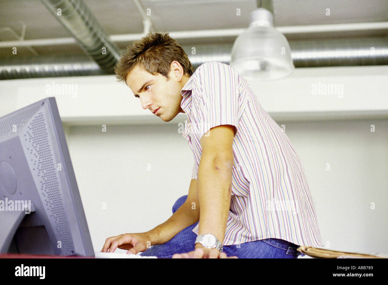 Man using computer Stock Photo