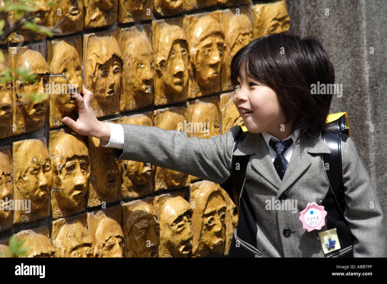 Kyoto, Japan, Japanese Primary School Student and Clay Faces of Alumni Stock Photo