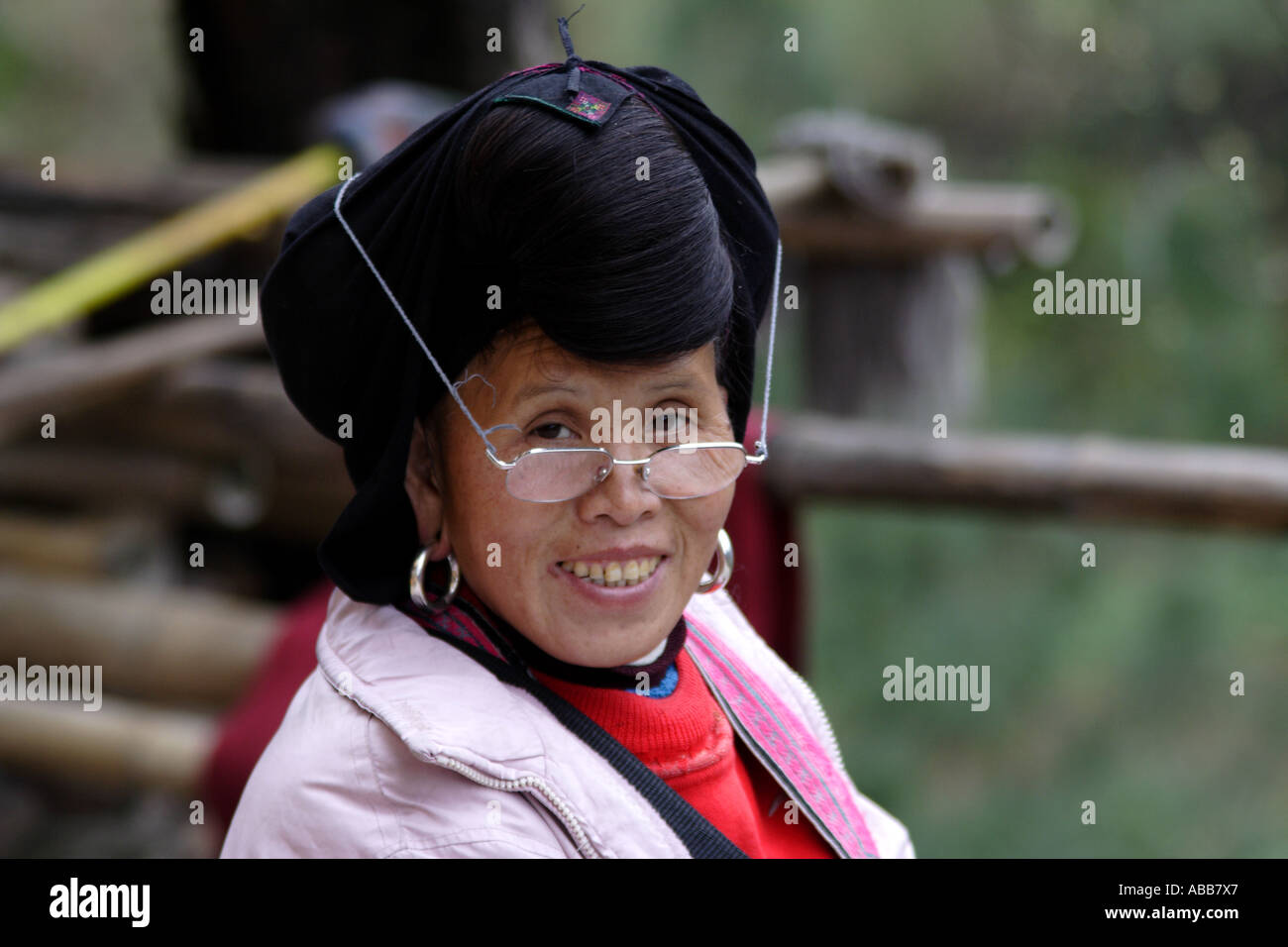 Yao Woman with Long Black Hair and Reading Glasses, Longsheng, Dazhai Village, Terraced Rice Fields Stock Photo
