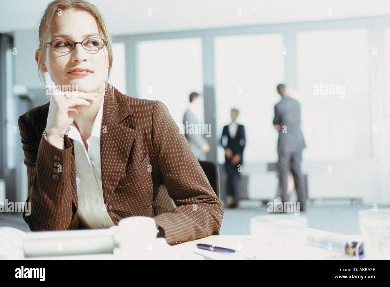 Businesswoman at desk Stock Photo - Alamy
