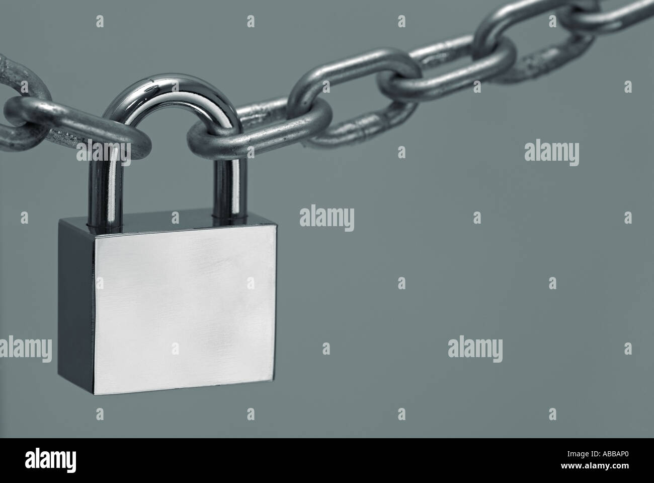 Metal Chain Secured with a Padlock Stock Photo