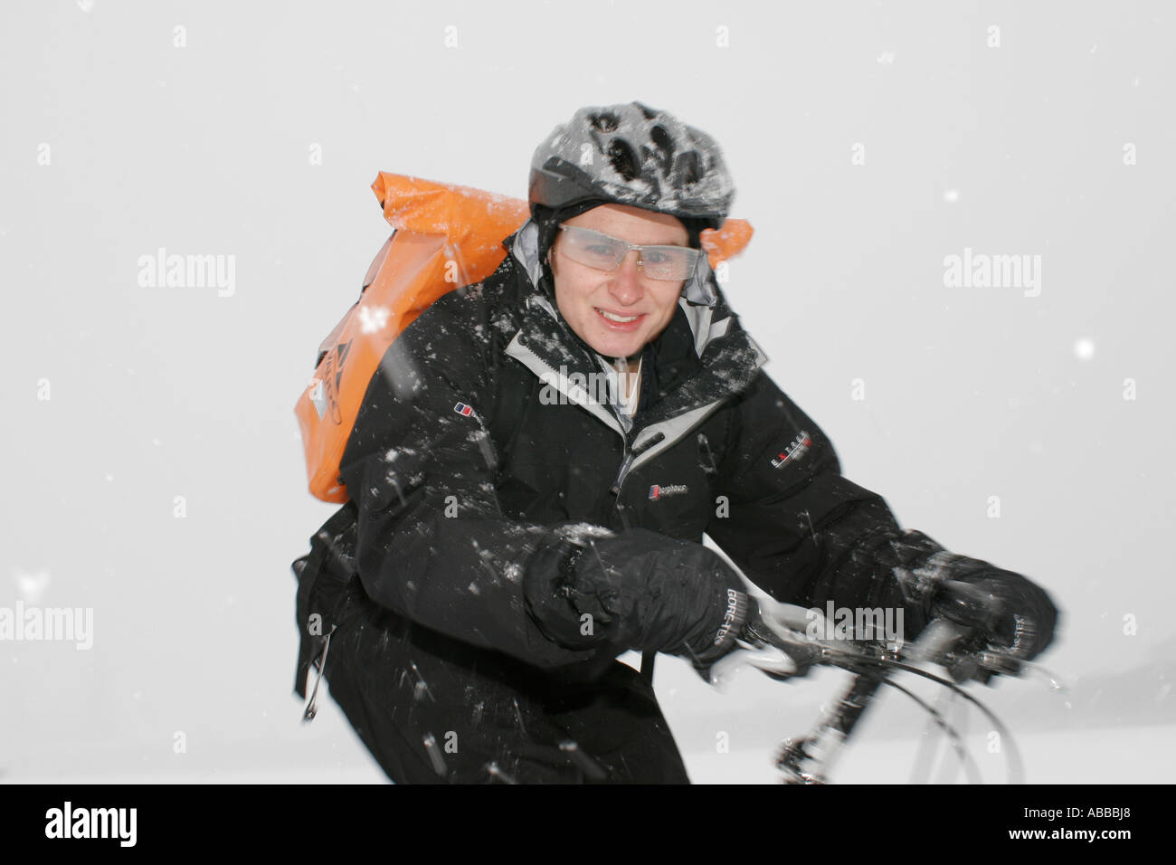 Bicycle courier in winter Munich Bavaria Germany Europe Stock Photo