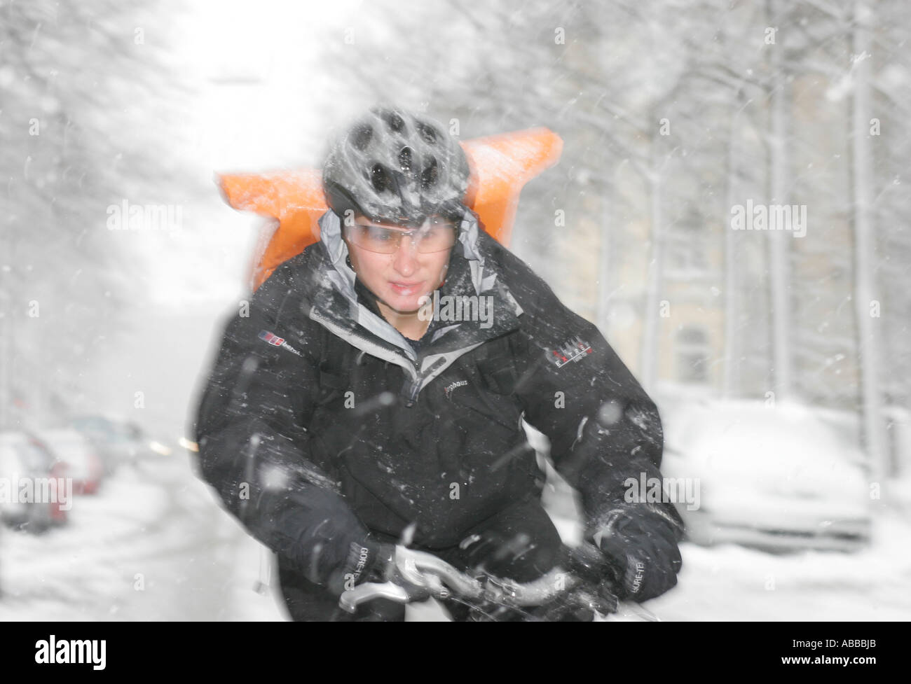 Bicycle courier in winter Munich Bavaria Germany Europe Stock Photo
