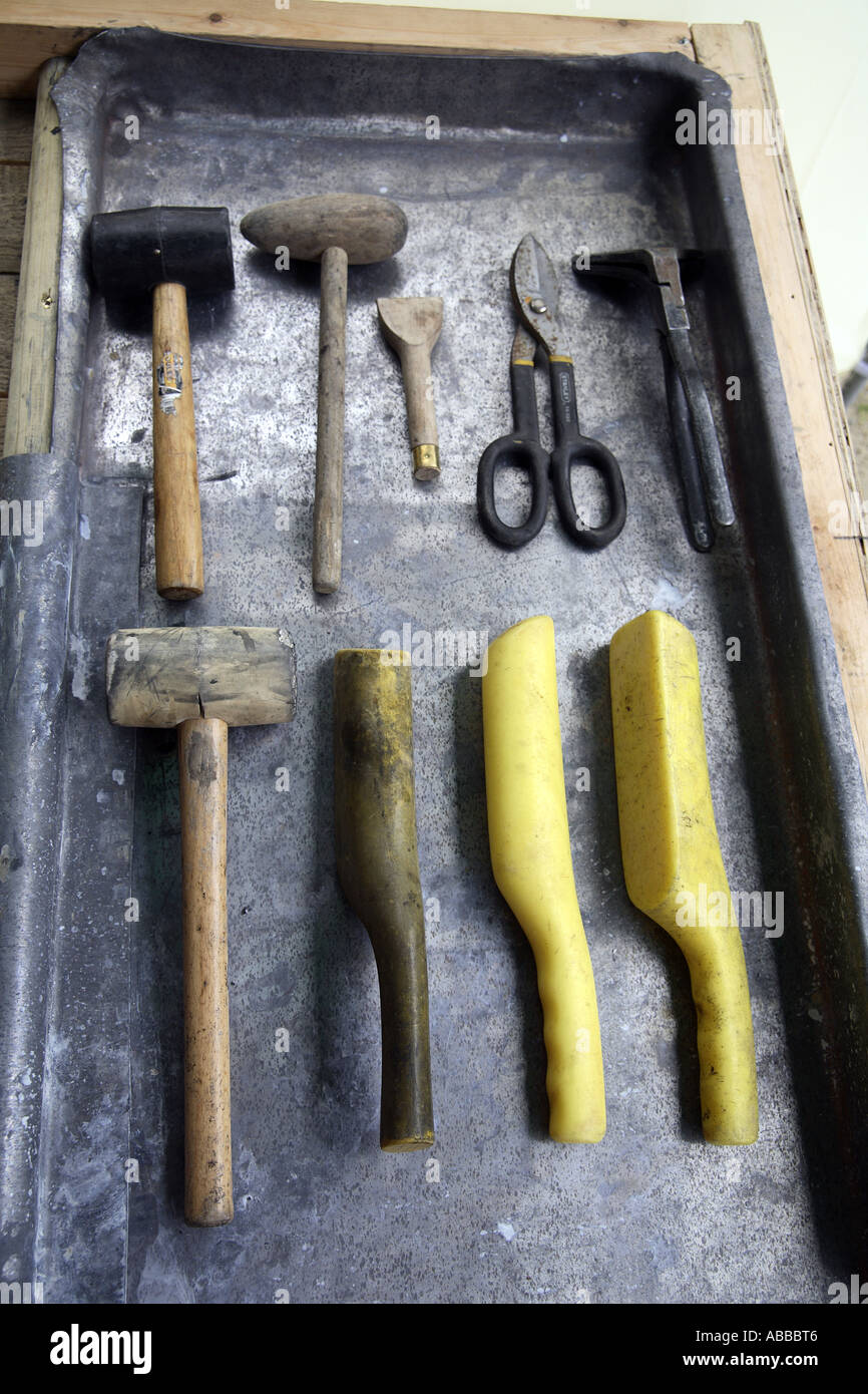 Complete set of Lead Sheet Workers tools on top of a bay covered in lead sheet (contd..) Stock Photo
