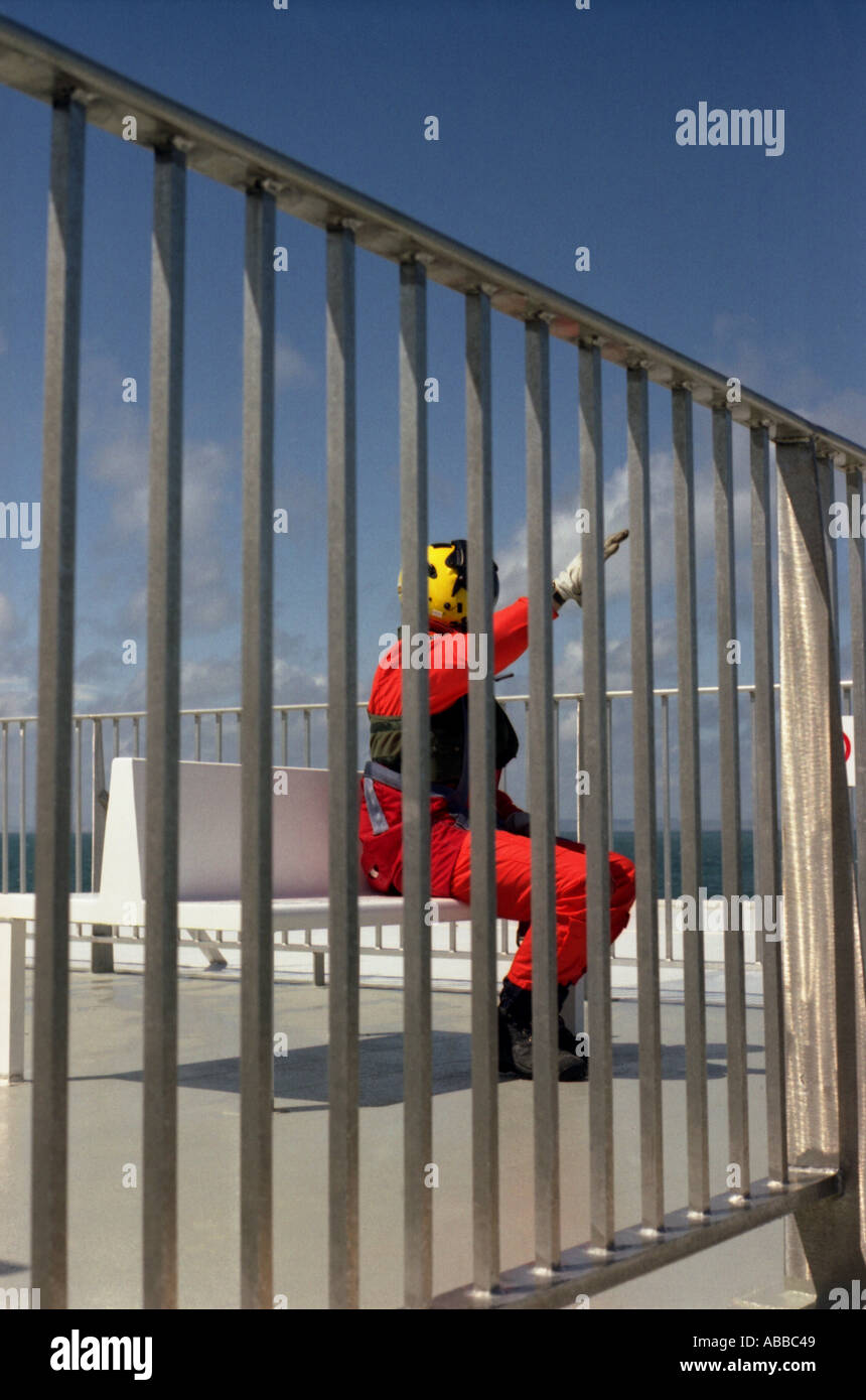 A man waiting for the Coastguard Rescue Helicopter to come and rescue ...