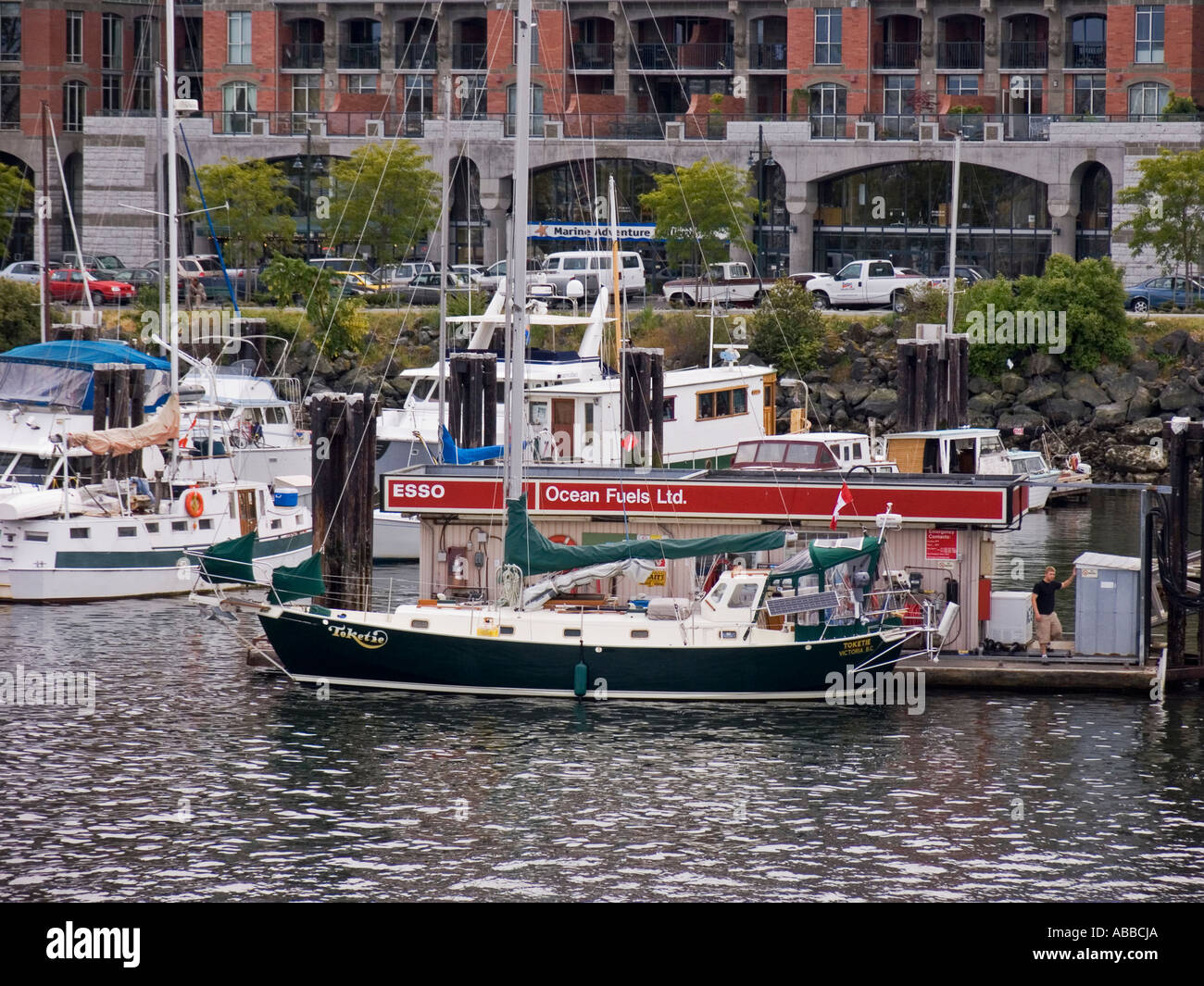 Sailboat takes on fuel at marina gas station at Inner Harbour Victoria