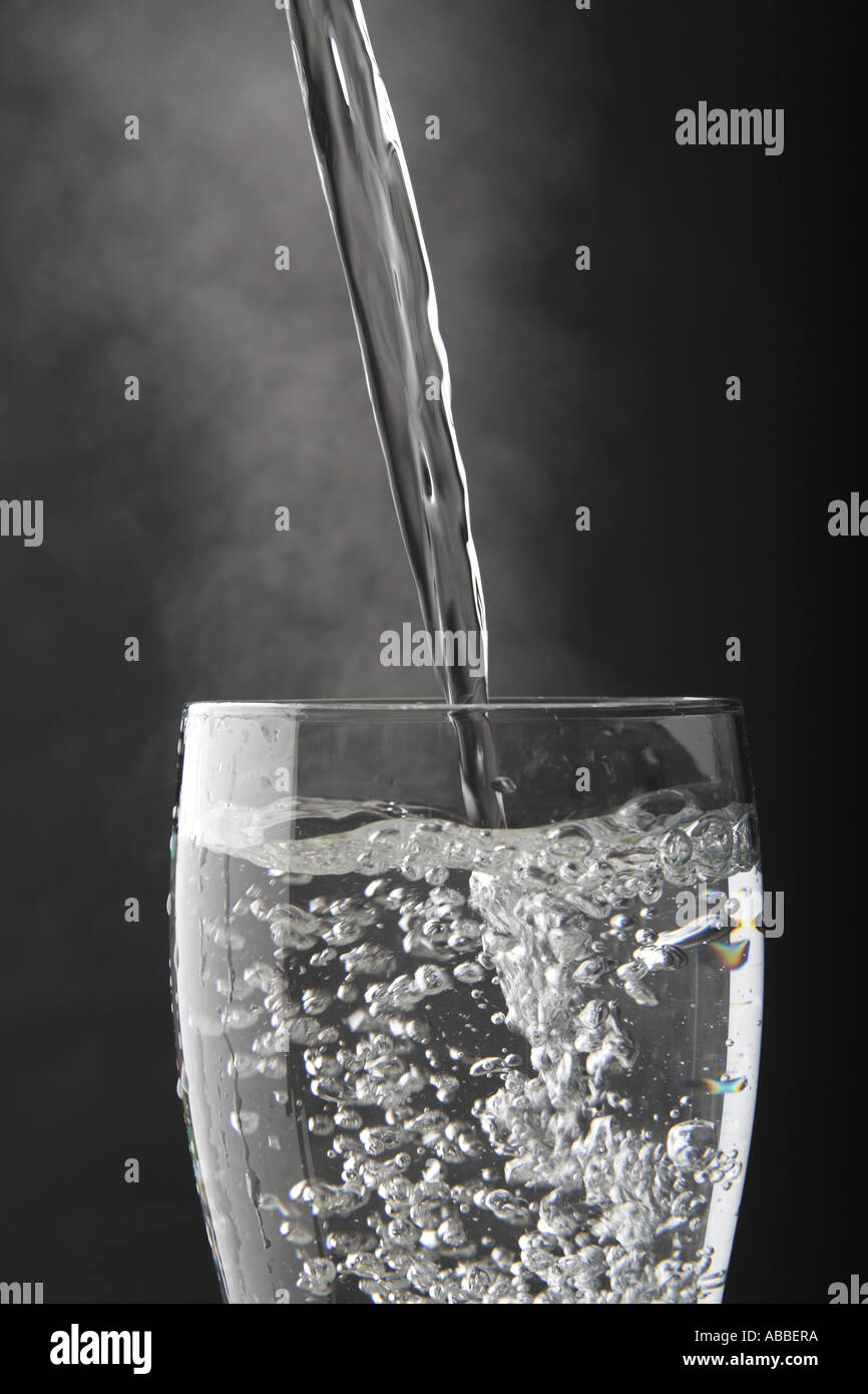 Water being poured into a glass Stock Photo Alamy