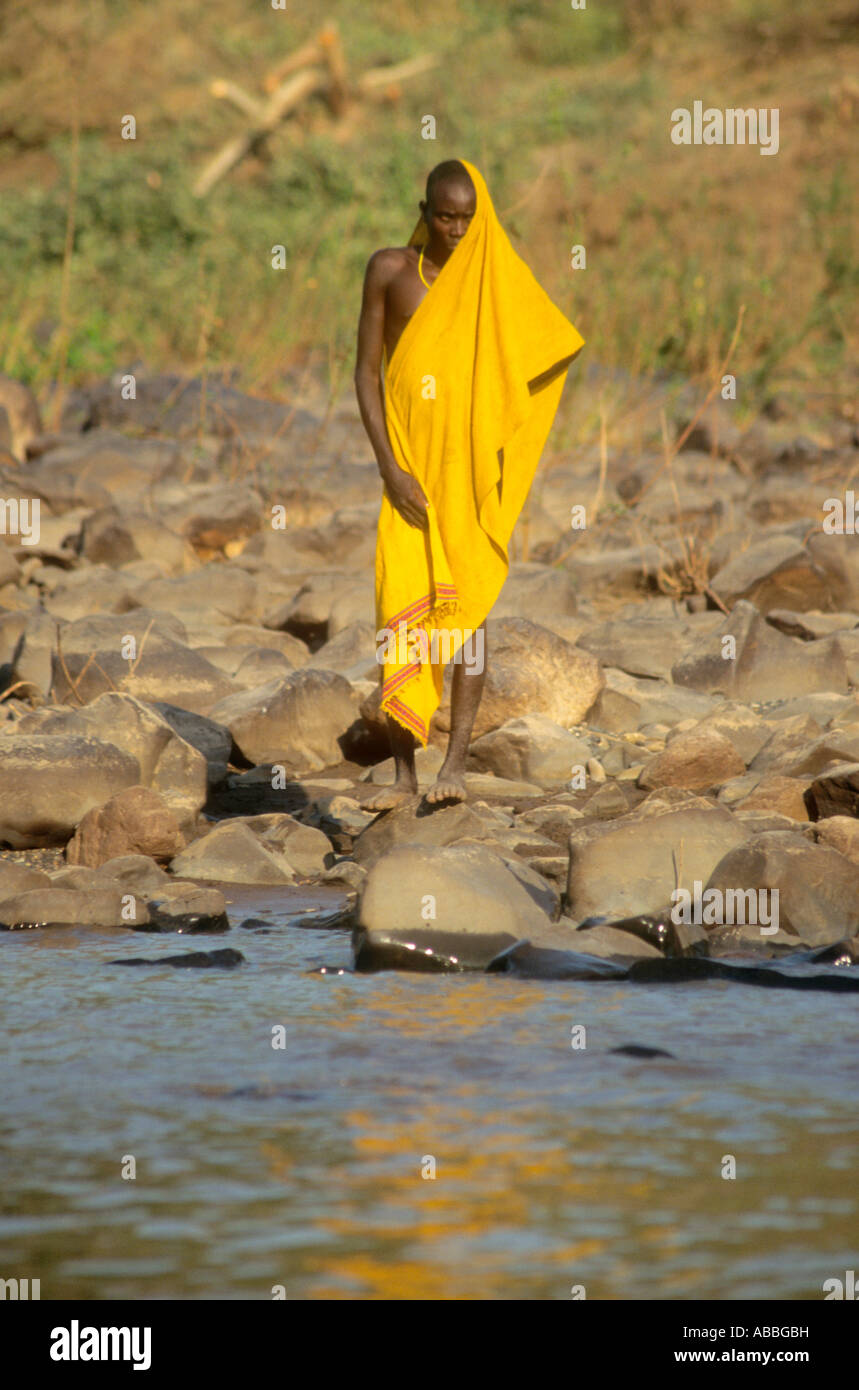 Bodi tribesman wearing yellow shuga on the banks of the Lower Omo River Ethiopia Stock Photo