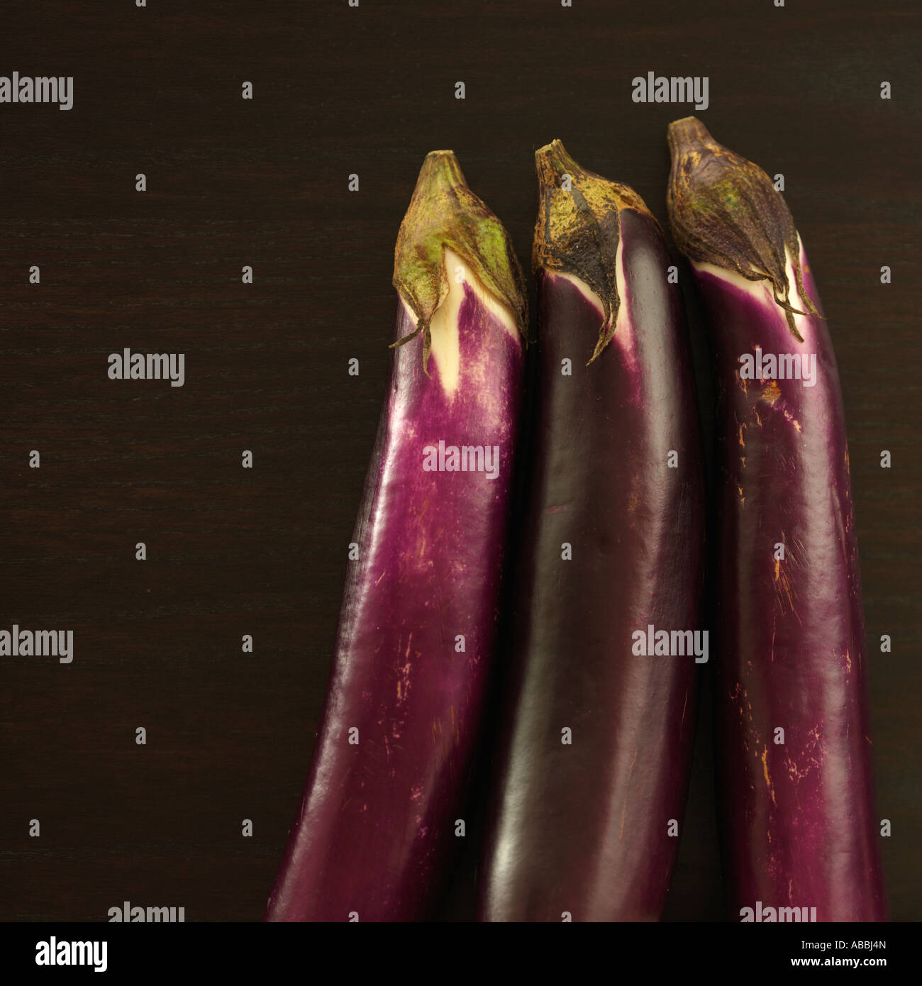 Three Eggplant on Dark Background Stock Photo