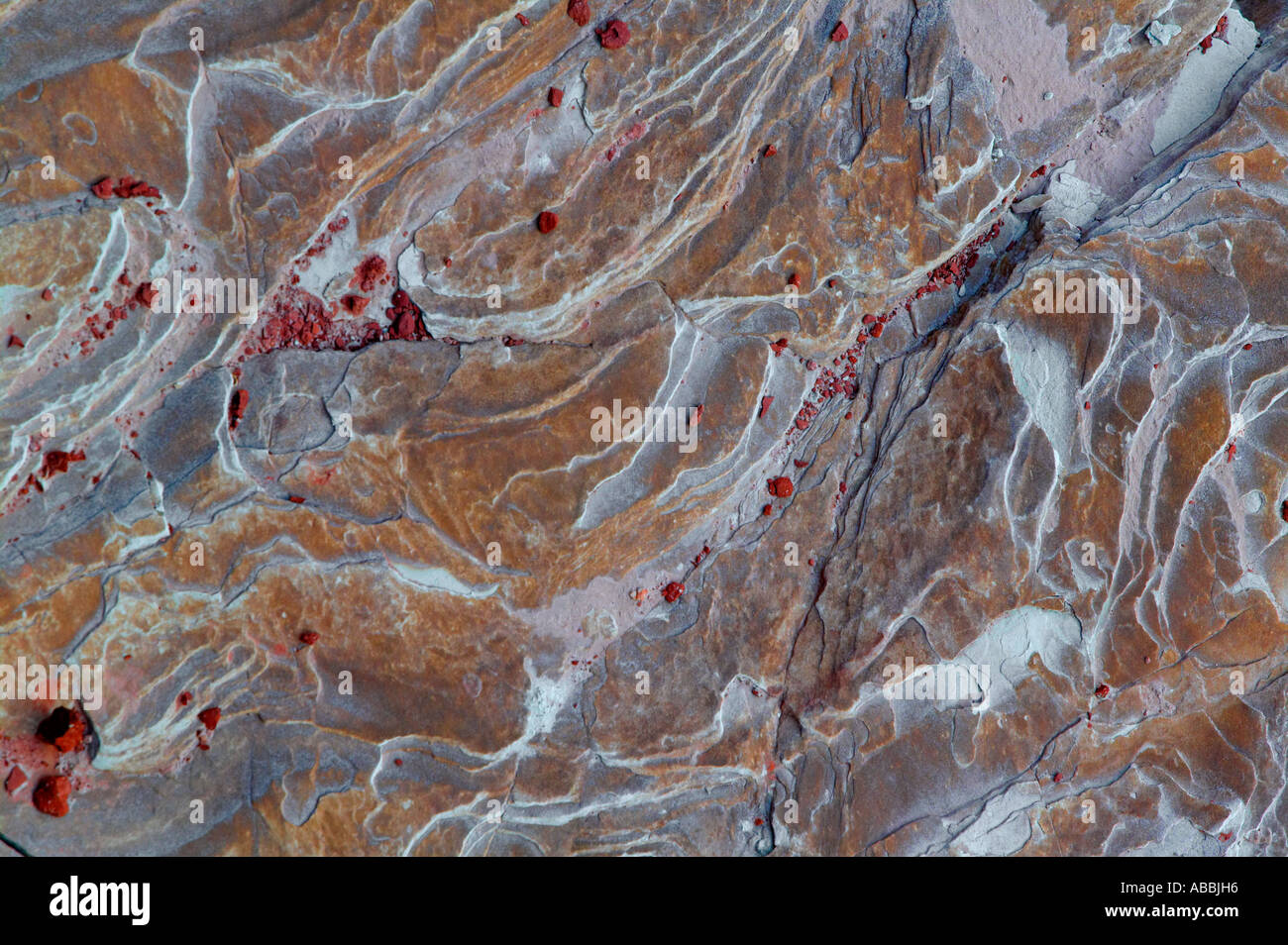 Spoted Red Rocks Textured brown rock with swirls and red spots Stock Photo - Alamy