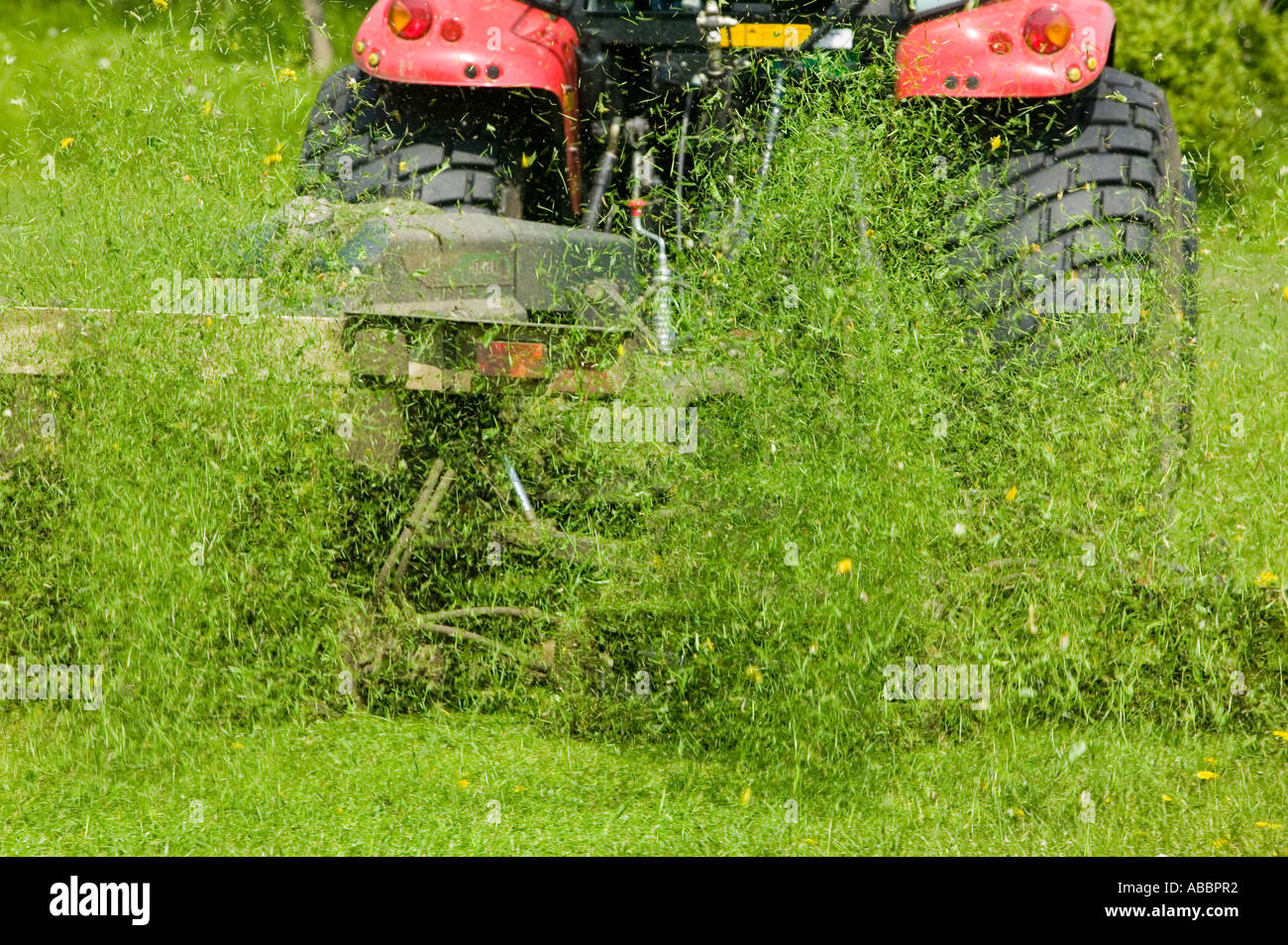 cutting grass with tractor and industrial grass cutting machine, Leicester, Leicestershire, UK Stock Photo