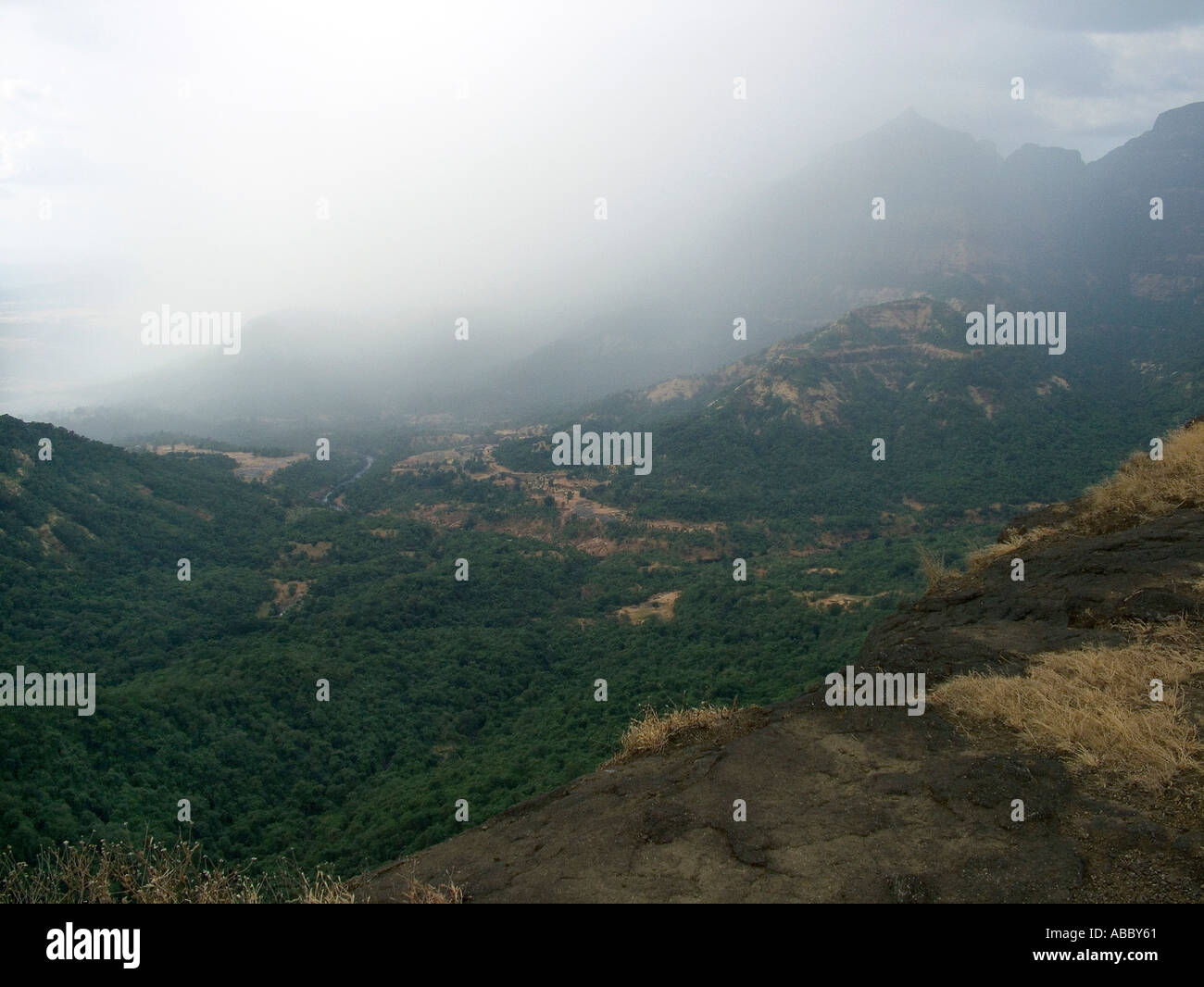 AHP70225 Land mountain sky Misty landscape at Malshej about 200 kms from Bombay now Mumbai Maharashtra India Stock Photo