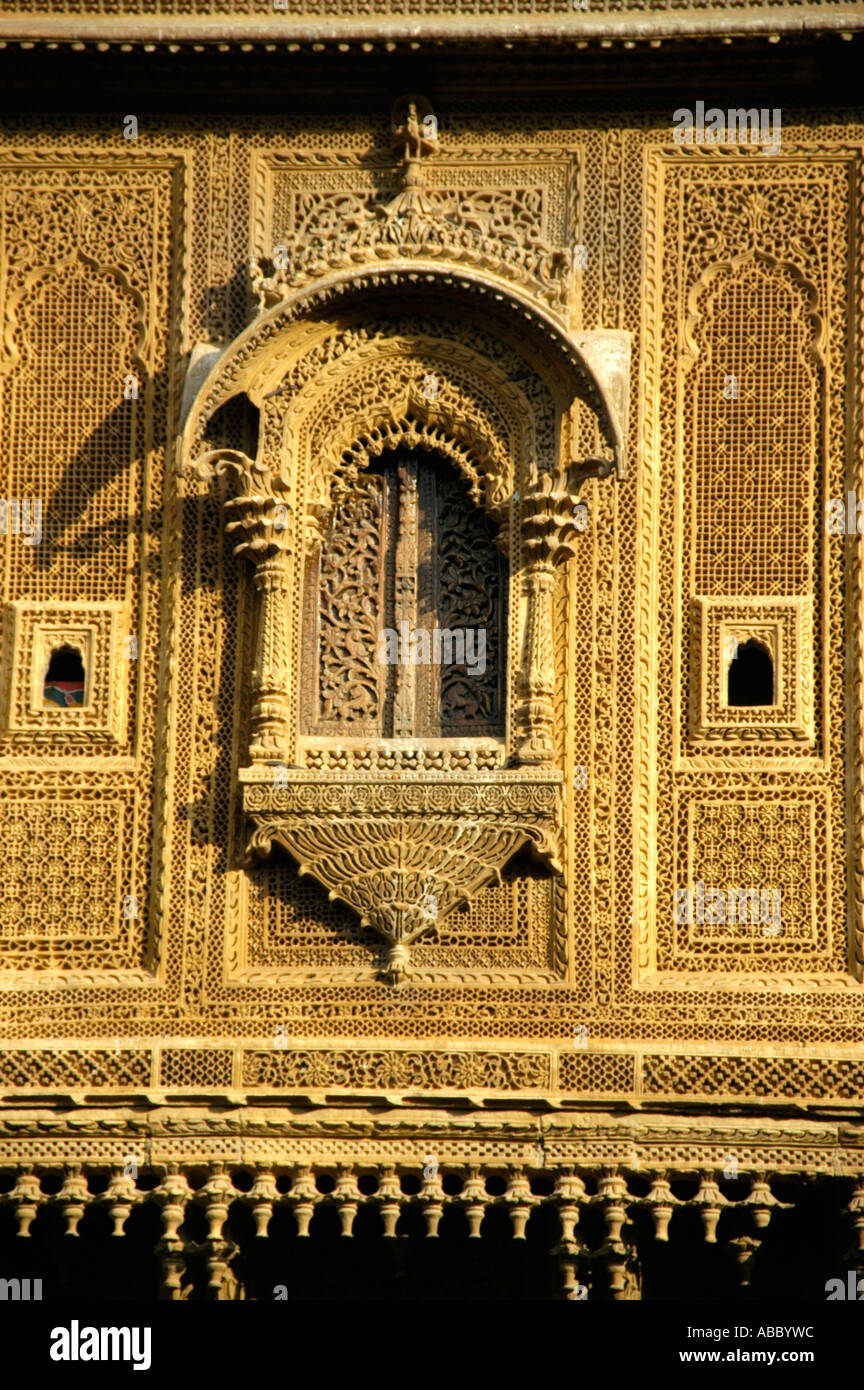 Window decorated in fine arts of yellow sandstone old town Jaisalmer Rajasthan India Stock Photo