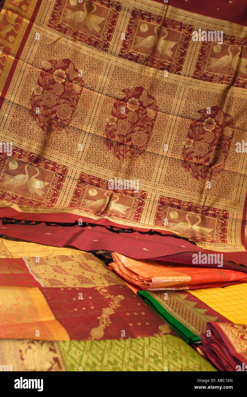 Kanchipuram Silk Saris are folded and laid out ready for inspection by prospective customers