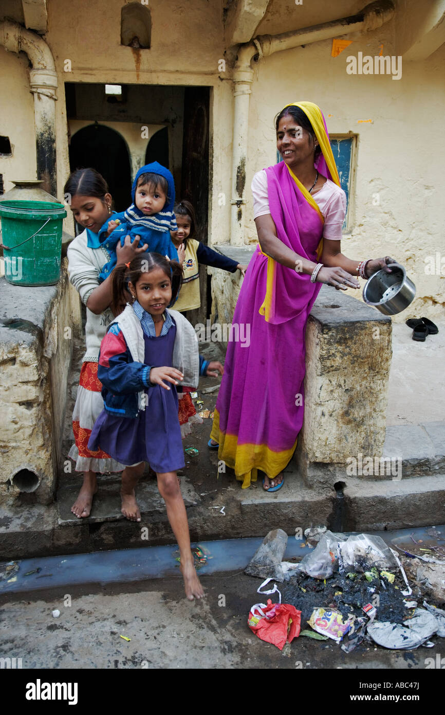Family at entrance of their home India Stock Photo