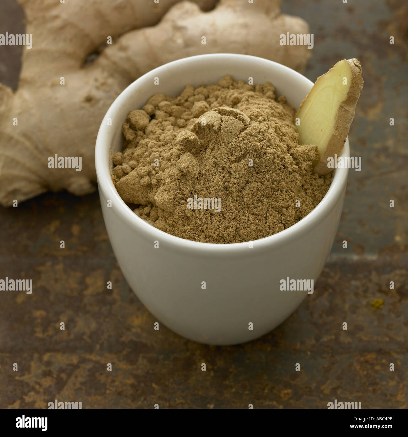 Root ginger and powdered ginger one of a series of spice images Stock