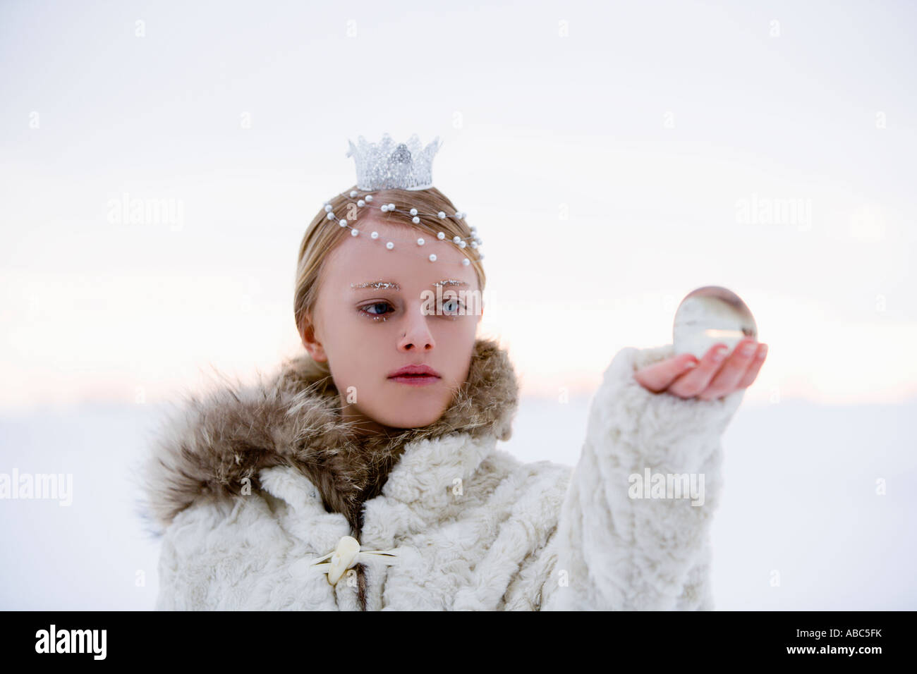 portrait of snow queen holding crystal ball Stock Photo