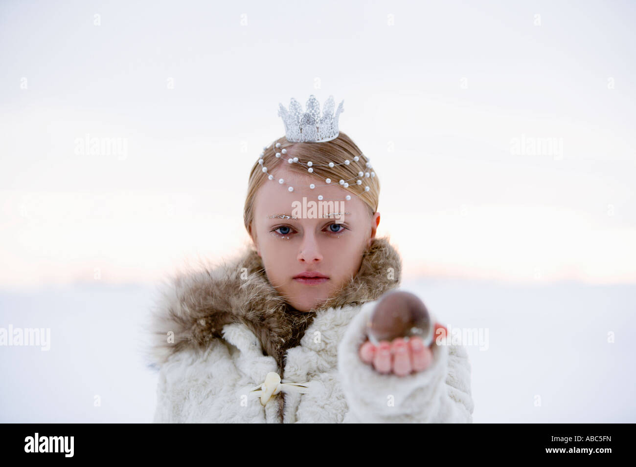 portrait of snow queen holding crystal ball Stock Photo