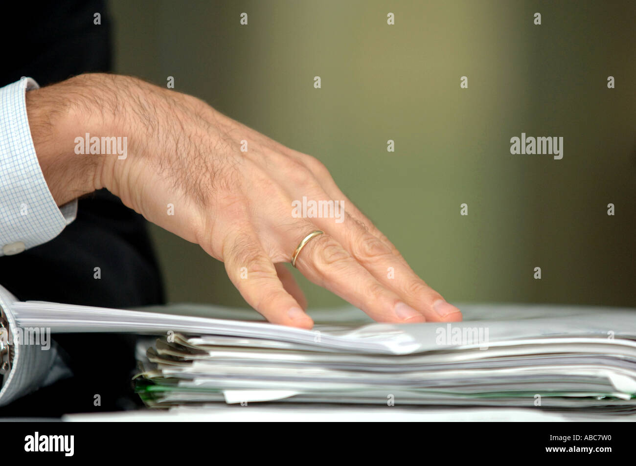 Hand on a pile of documents Stock Photo Alamy