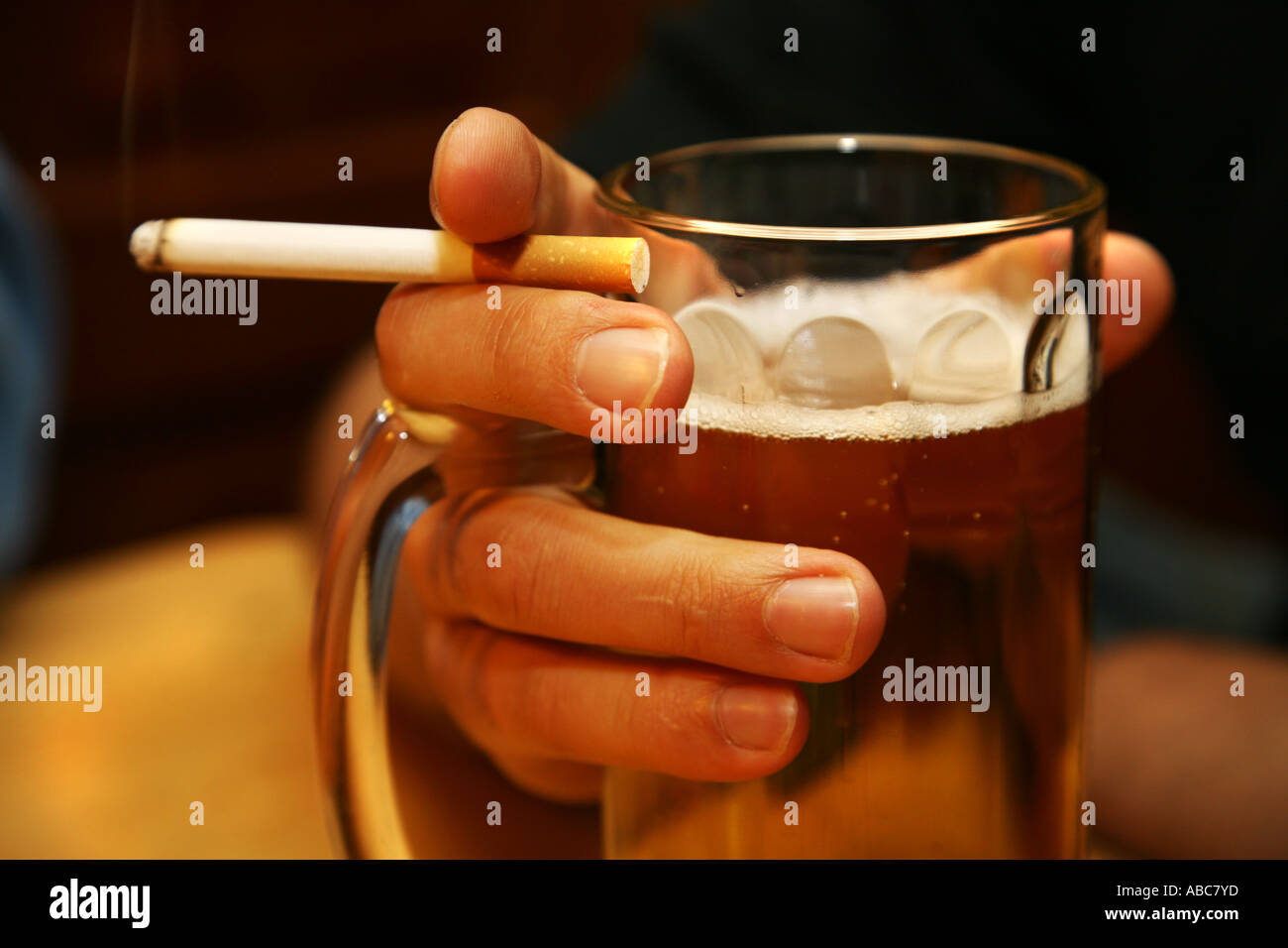 Holding Beer Cigarette Stock Photos & Holding Beer Cigarette Stock
