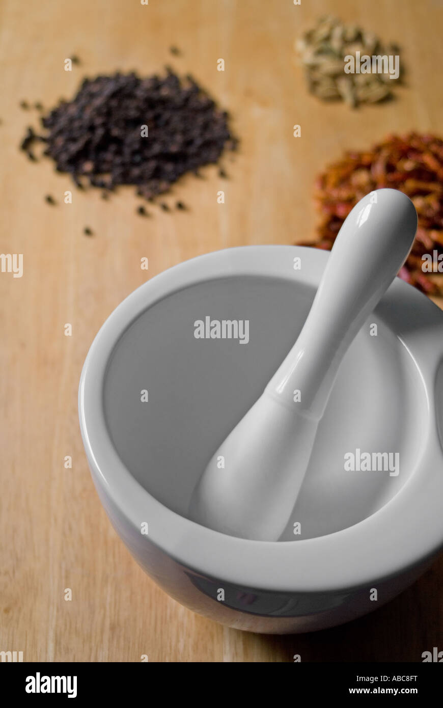 Pestle and mortar with seeds and grains Stock Photo Alamy