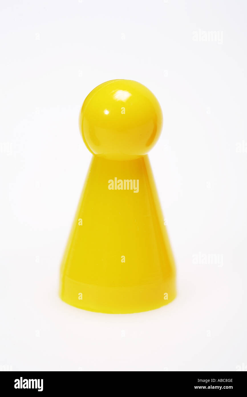 Yellow game piece Stock Photo - Alamy