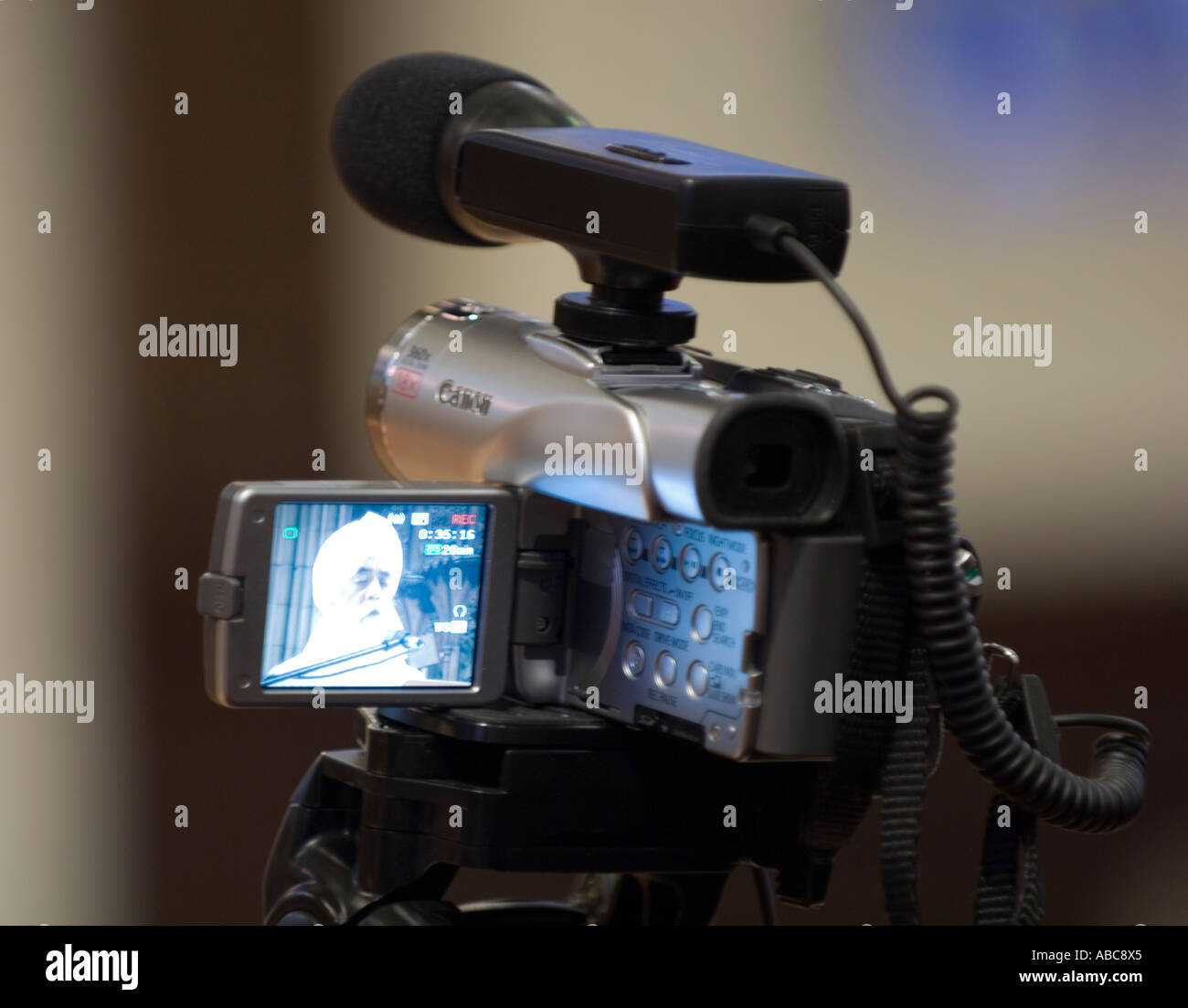 Video camera recording a Sikh conference Stock Photo