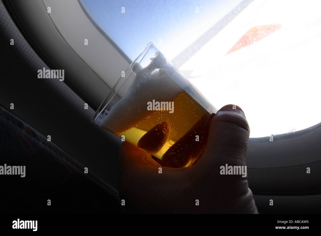 Drinking alcohol onboard during an airplane flight Stock Photo Alamy