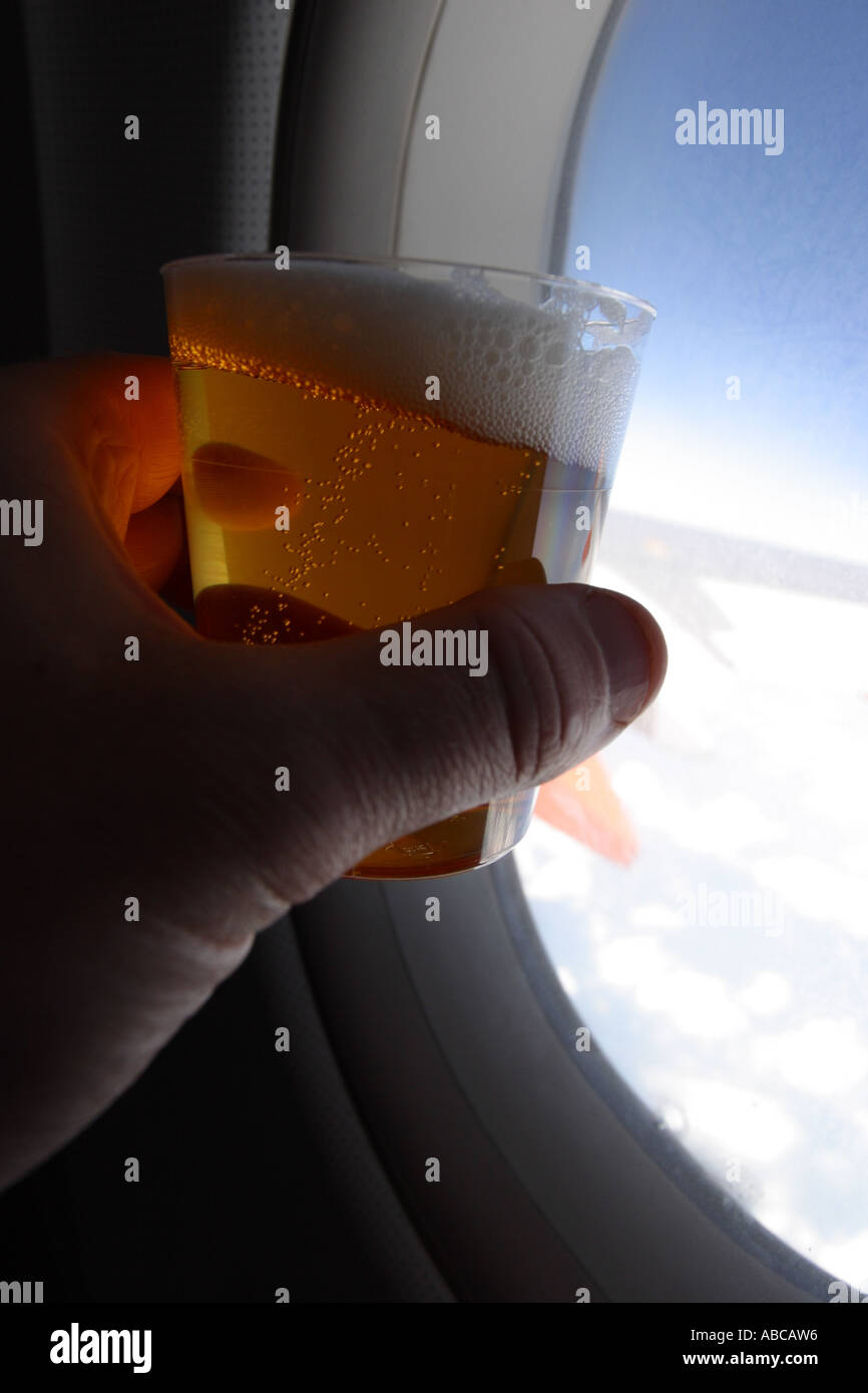 Drinking alcohol onboard during an airplane flight Stock Photo Alamy