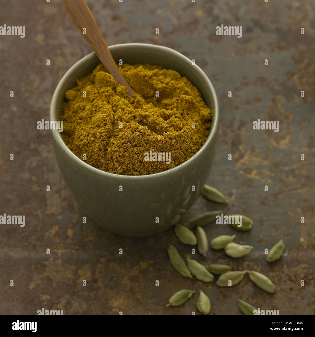 Curry powder and cardamom pods one of a set of similar spice shots