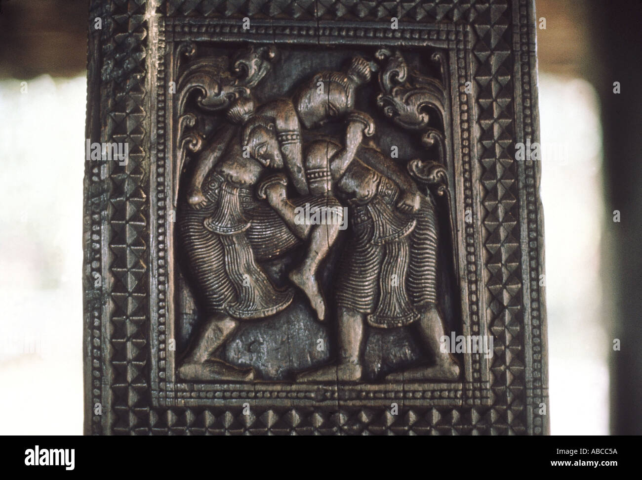 Ancient architecture Kandyan temple Bas relief wrestlers Embekke Devale, Kandy - Sri Lanka Stock Photo