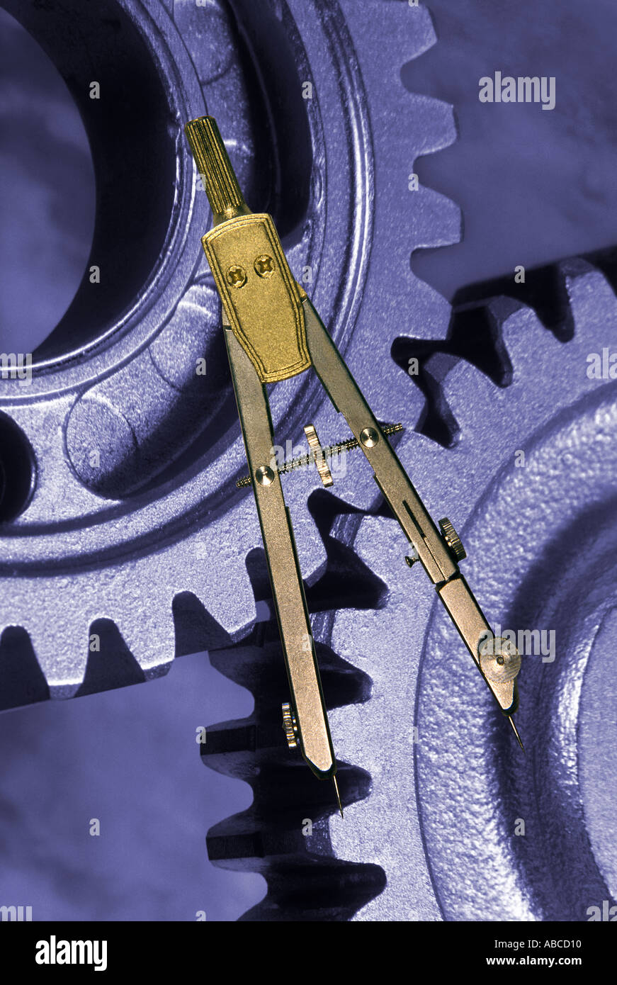 technical drawing measuring compass and meshing cog wheels Stock Photo