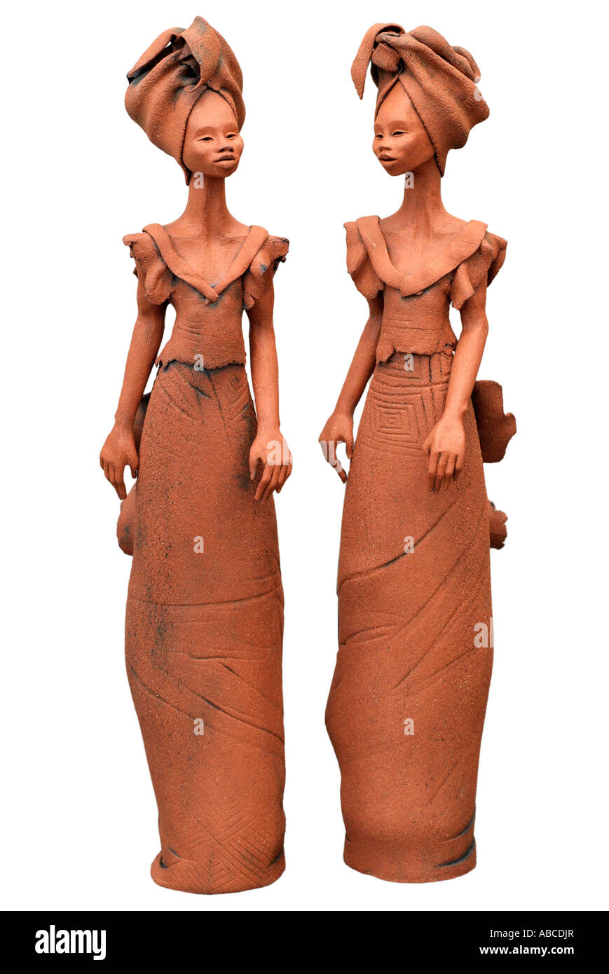 Figurative African female women form stand standing  tall thin elongated elegant figure carrying possession figures character tr Stock Photo